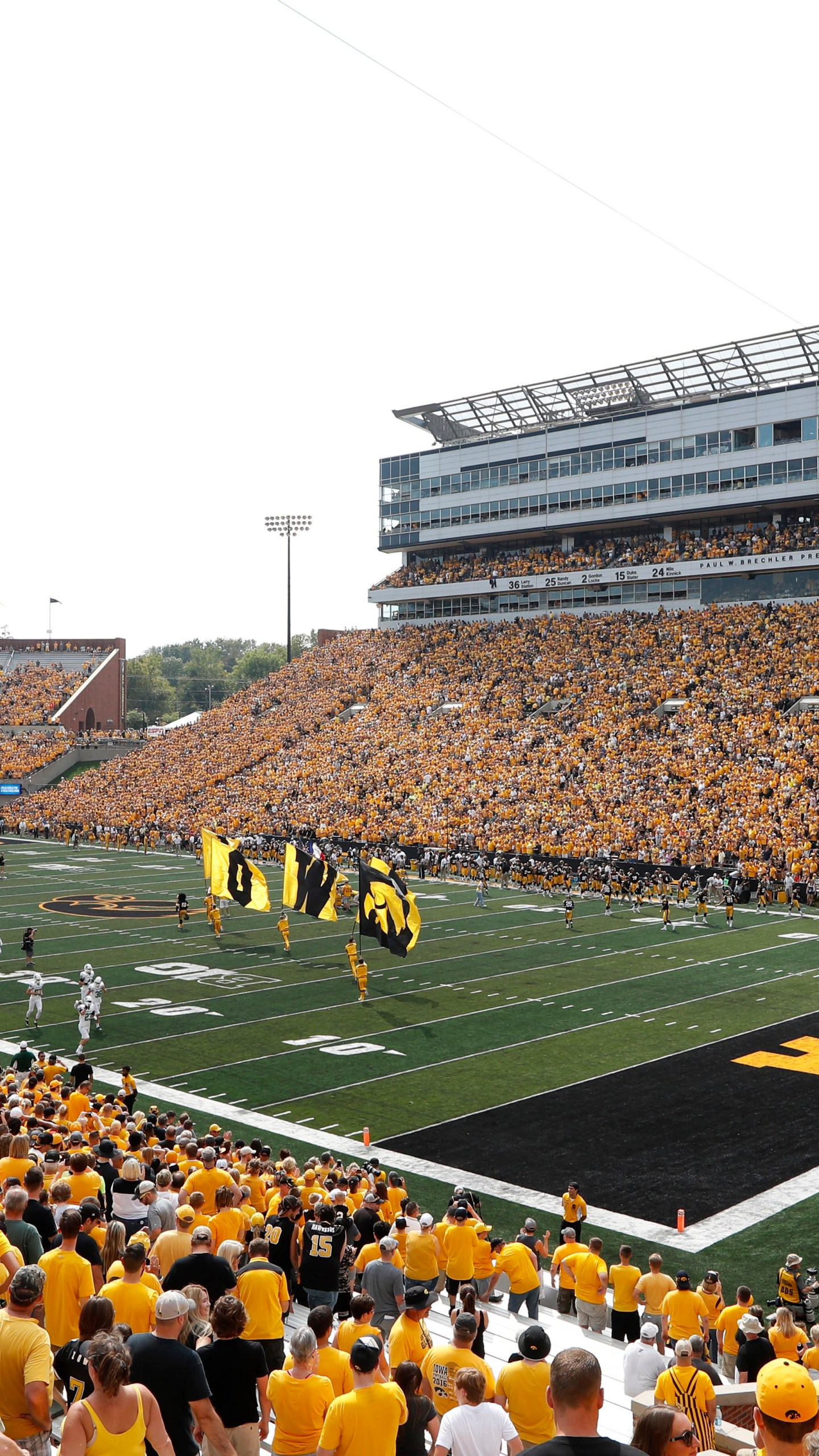 FILE - Fans cheer before an NCAA college football game between Iowa and North Texas at Kinnick Stadium in Iowa City, Iowa, Sept. 16, 2017. The University of Iowa announced 26 of its athletes across five sports are alleged to have participated in sports wagering in violation of NCAA rules. (AP Photo/Charlie Neibergall, File)